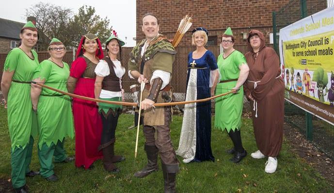 Nottingham's official Robin Hood, Tim Pollard, meets catering staff at Robin Hood School in Bestwood Park