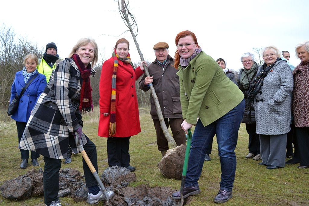 TREE-MENDOUS: President of Nottingham City WI Sarah Manton and Cllr Roxanne Ellis from Gedling Borough Council took part in the tree planting to mark International Women's Day. Gedling members from the Institute, park rangers and Cllr Peter Barnes also took part.