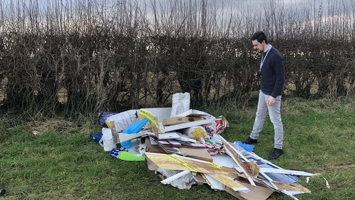 Cllr Sam Smith with rubbish on Stoke Lane in Stoke Bardolph